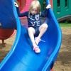 A Little Angel going down the slide