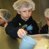 Preschoolers measure ingredients