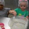 Preschoolers making yummy cookies